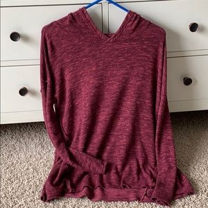 Long sleeve soft and plush hooded sweater.